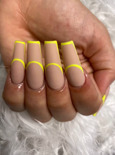 Photo of manicured nails with beige and neon yellow outline