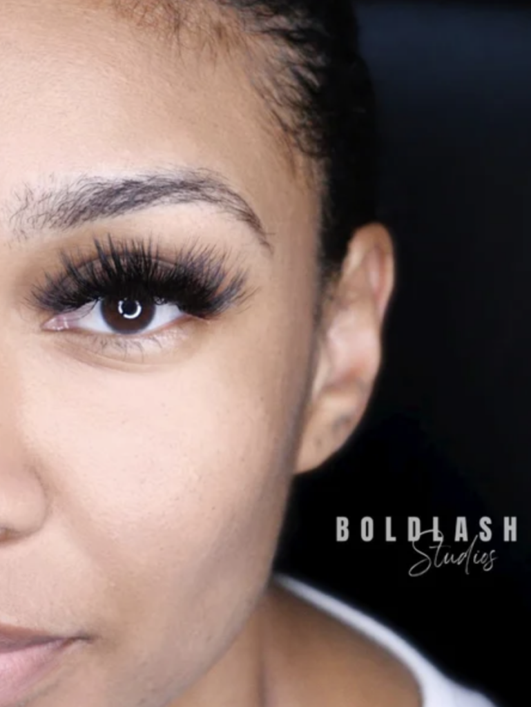A woman's eye with a set of volume lash extensions 