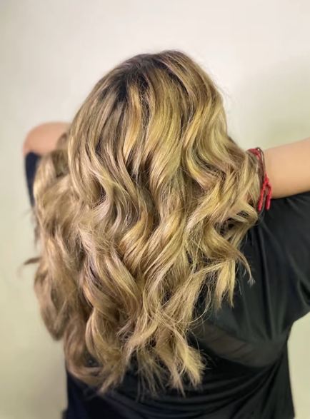 bold blonde separated curly hairstyle 