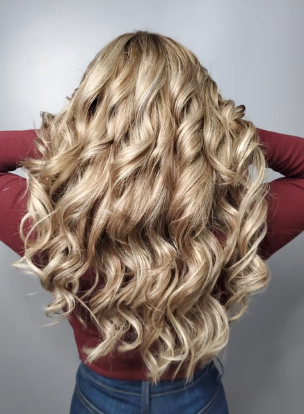 curly blonde hair with a curling iron style