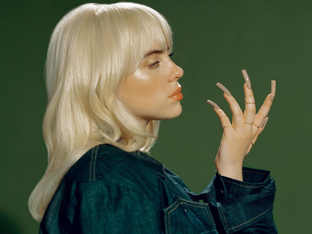 Photo of Billie Eilish with blonde hair and bangs