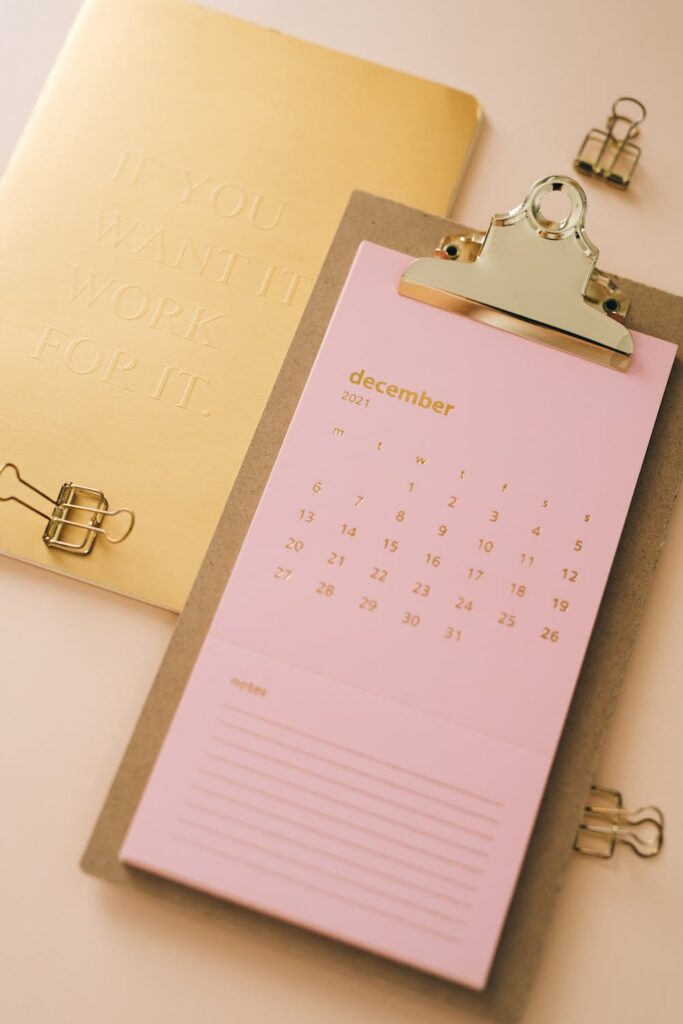 Unsplash image of a pink December calendar on a clipboard 