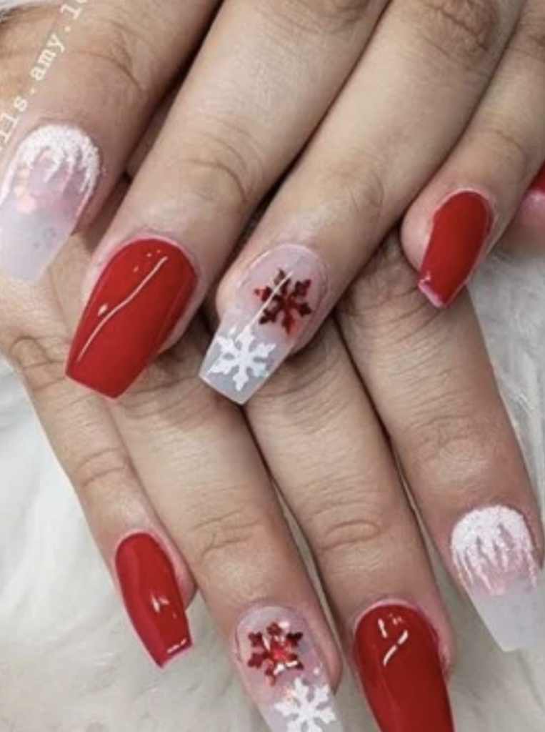 Medium length red nails with red and white snowflake and icicle decals. 
