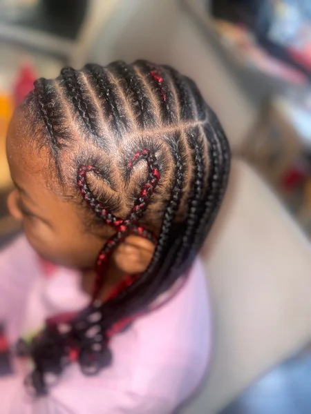 Black braids with a heart design braided into the side. 