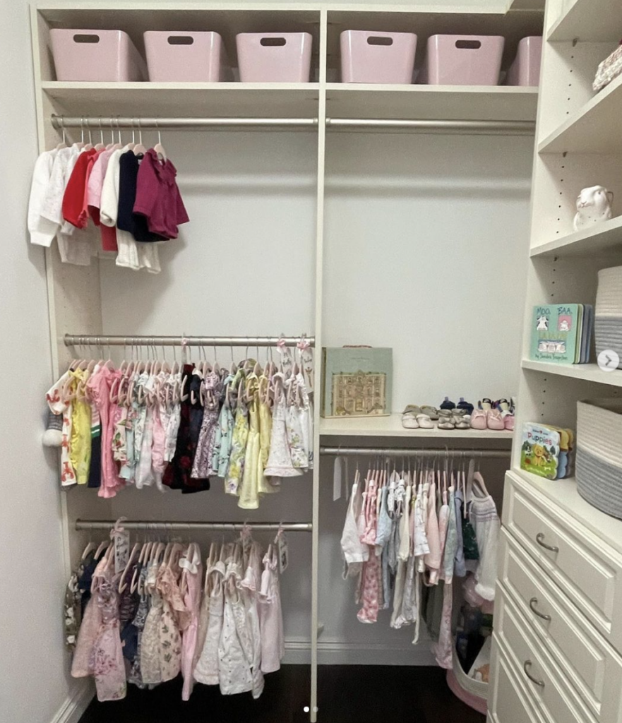 A child's closet that has been organized by a professional. 