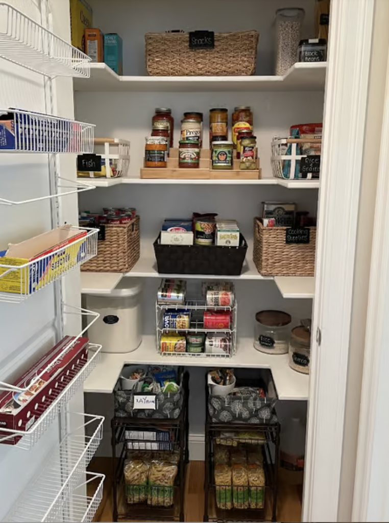 An organized pantry with all food items in bins 