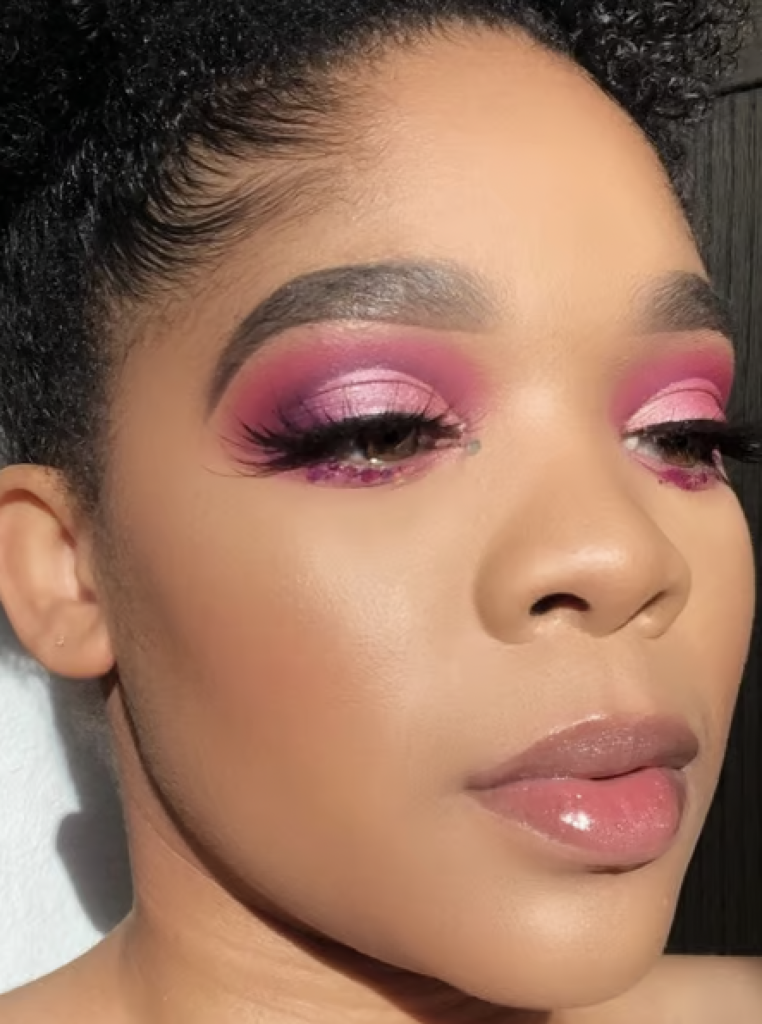 Woman with ombre pink eyeshadow and long lashes