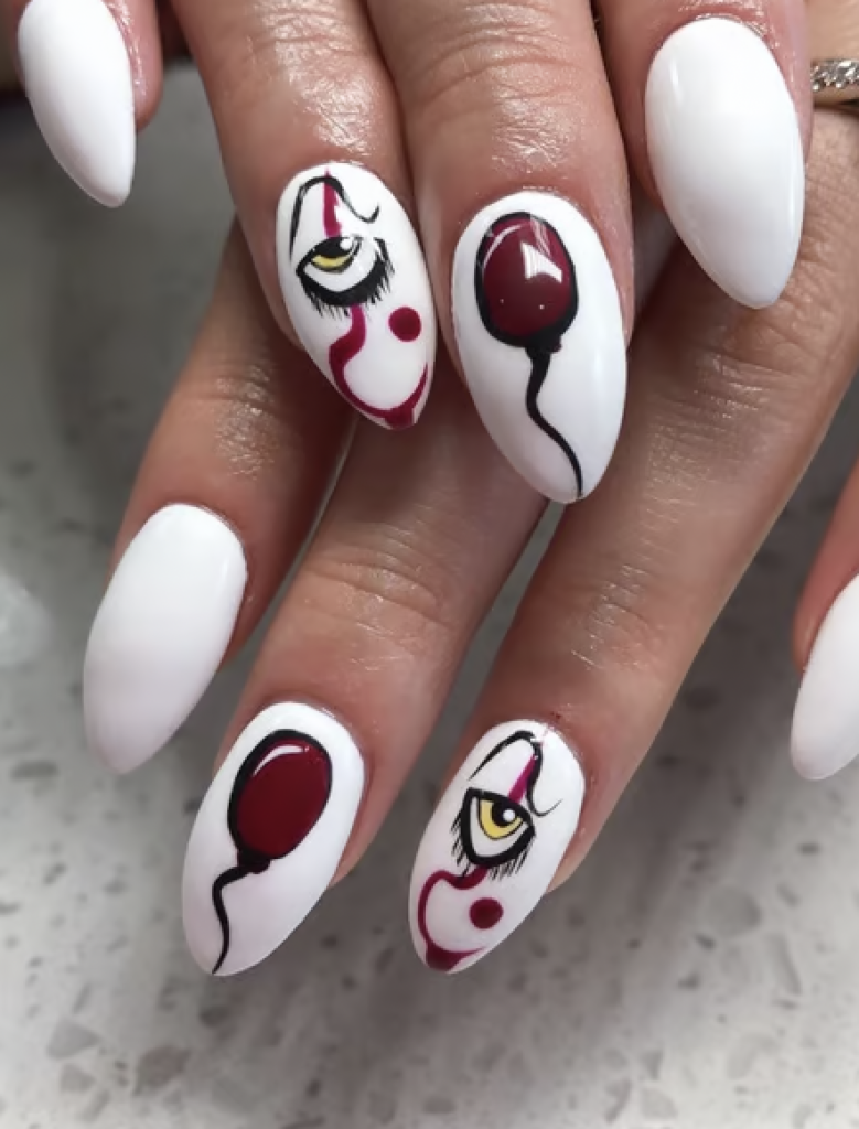 "It" inspired white manicure with a balloon decal and eye decal. 