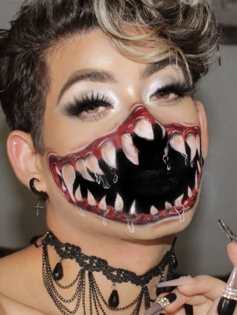 Ultra wide monster mouth makeup with sharp teeth and bloody gums